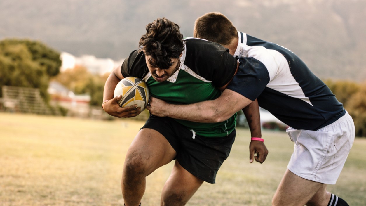 A rugby tackle, at the centre of research into concussion rates and tackle height law changes.