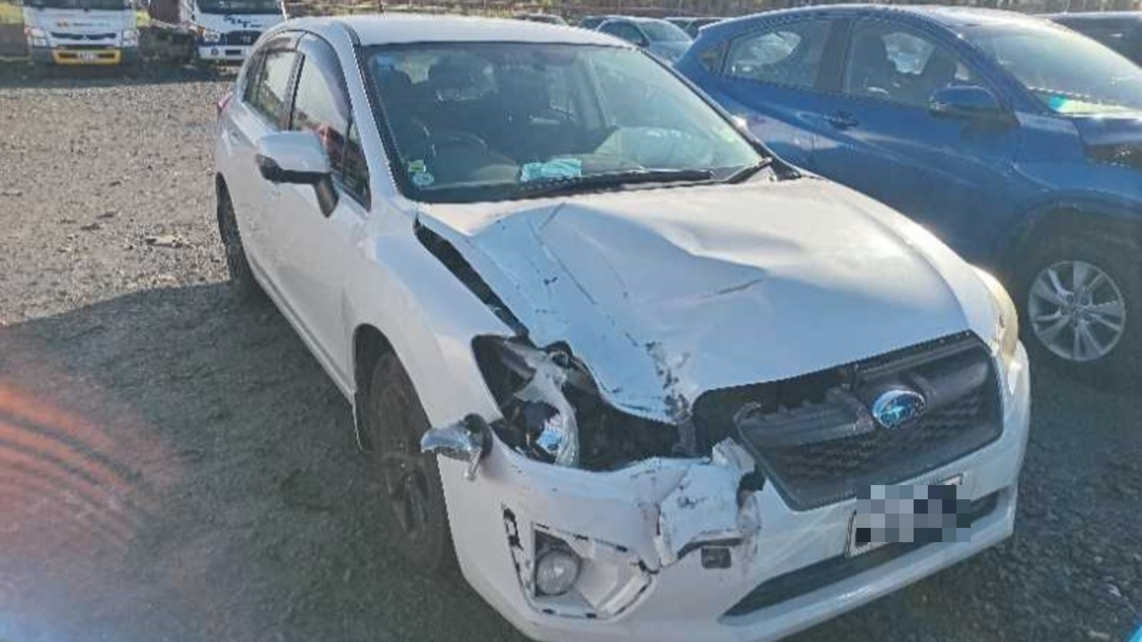 Damage to a family car struck by a truck tyre on an Auckland motorway.