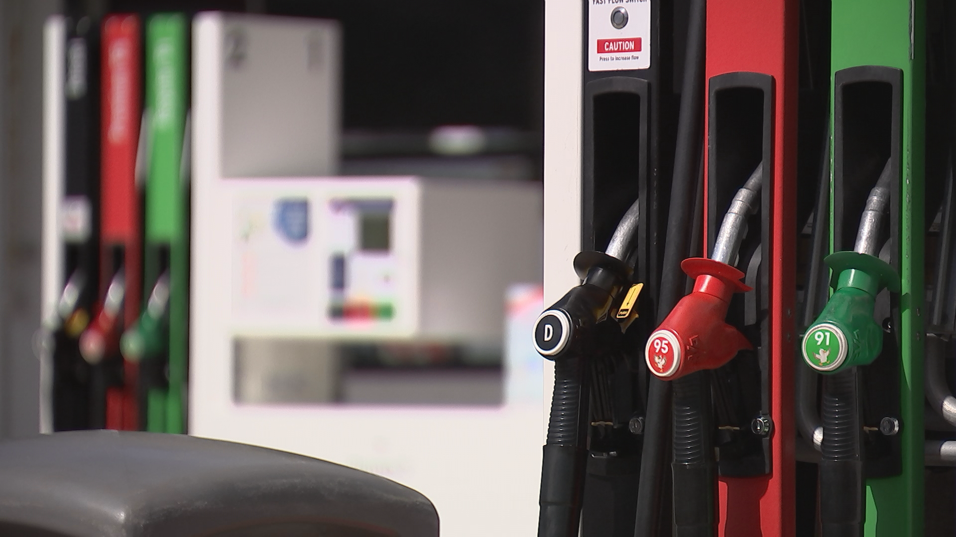 Fuel prices displayed on a service station board in New Zealand.