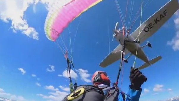 A paraglider in flight after a midair collision with a light aircraft.