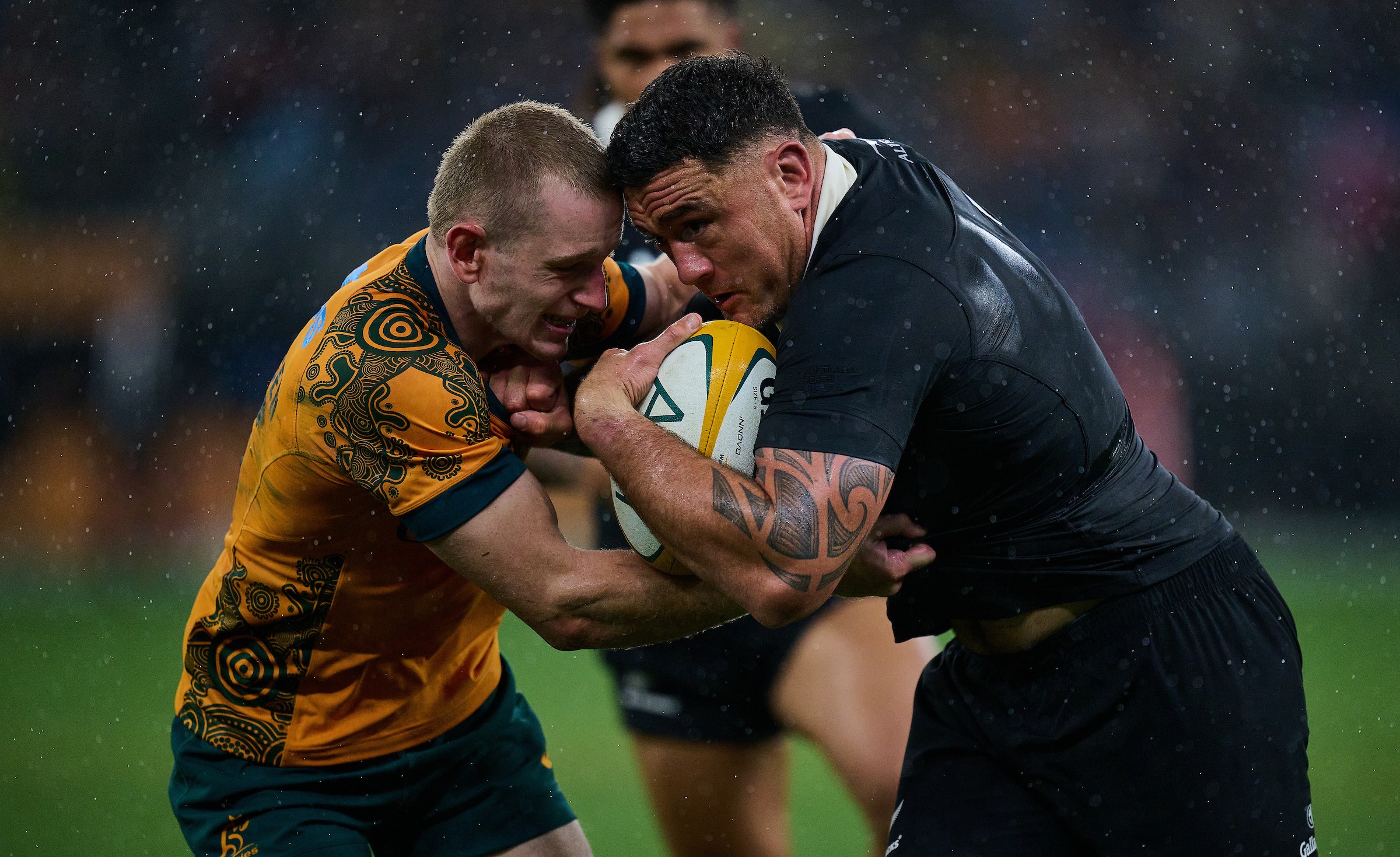 All Blacks and Wallabies players contesting a trans-Tasman Test match.
